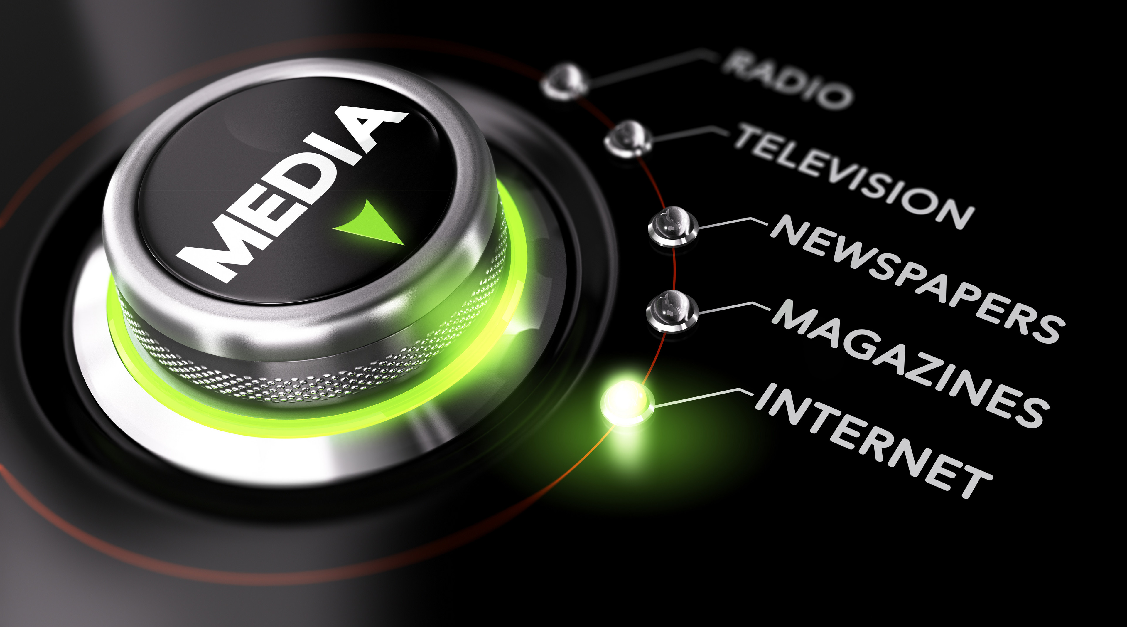 beleuchteter Schaltknopf, beschriftet mit dem Wort Media, zeigt eine Auswahl zwischen verschiedenen Medien-Bereichen