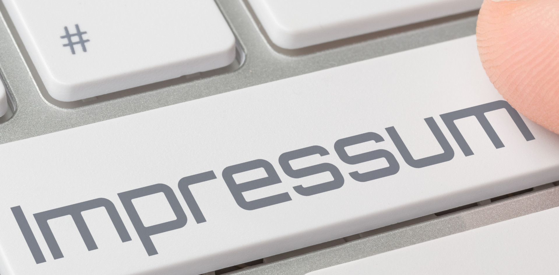 Computer-Tastatur mit Schaltfläche Impressum